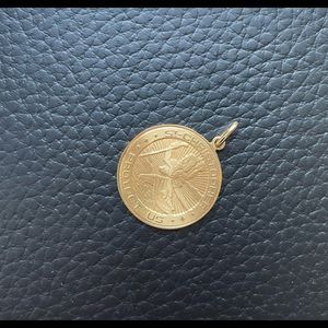 Tiffany & Co yellow gold pendant of Saint Christopher.